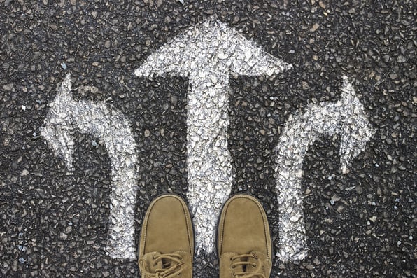a man stands at a path where he has three choices: left, right, or straight ahead